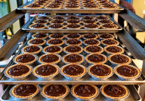 Chocolate Tarts on a Bakery Rack